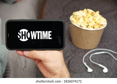 Showtime Logo On The Mobile Phone Screen With Popcorn Box And Apple Earpods On The Background, September 2020, San Francisco, USA