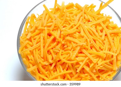 Shredded Cheddar Cheese In A Bowl On A White Background