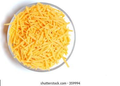 Shredded Cheddar Cheese In A Bowl On A White Background