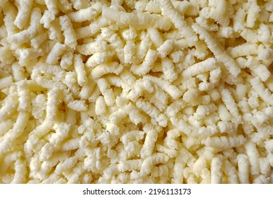 Shredded Cheese In The Foreground