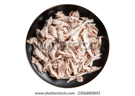 Shredded chicken meat in a plate. Isolated on white background