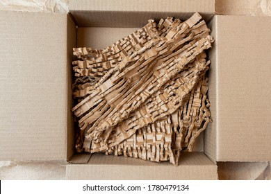 shredded, cut paper, carton for recycling inside a cardboard box. Ecology background.