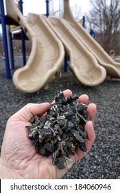 Shredded And Cut Pieces Of Used Recycled Automobile Rubber Tire Crumb Reused As Soft Surface Ground Floor Filler Mulch Compound On Children Amusement Playground For Safety And Injury Prevention 