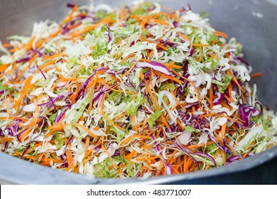 Shredded Lettuce, Carrot And Cabbage Mixed Together In A Big Bowl.