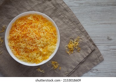 Shredded Mexican Cheese Mix In A White Bowl, Top View. Flat Lay, Overhead, From Above. Space For Text.