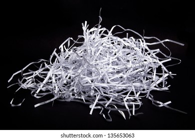 Shredded Paper Scraps Isolated On Black Background.