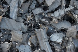 
Shredded Tire Pieces To Be Recycled Into Piles Of Rubber Material And Polluting Steel Wire