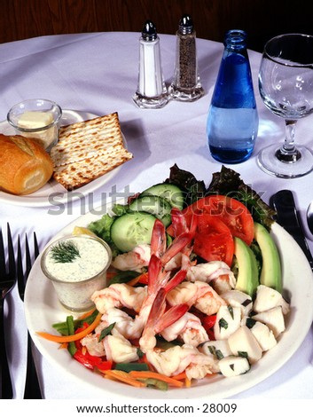 Shrimp and avacado dish on set table