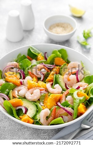 Shrimp, avocado and mango salad with fresh green lettuce. Prawn salad
