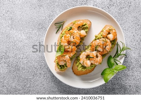Shrimp and avocado sandwich with baguette and sesame. Top view