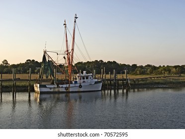 Shrimp Boat Moored In The Backwaters Of Charleston South Carolina At Sunset.