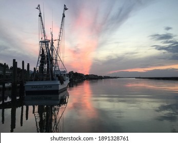 A Shrimp Boat At Sunset