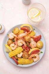 Shrimp Boil Heap With Corn, Baby Potatoes, Sausage And Lemons.