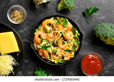 Shrimp And Broccoli Pasta Over Dark Stone Background. Tasty Healthy Dish For Dinner. Top View, Flat Lay