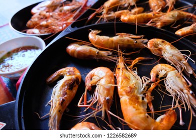 Shrimp burnt in electric pan - Shutterstock ID 1226582689