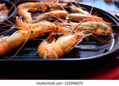Shrimp burnt in electric pan - Shutterstock ID 1232968375