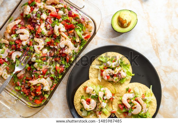 Shrimp ceviche, made with fresh ingredients, served\
with tostadas. Concept for food blogs, restaurant menus, travel,\
Latin America, seafood,\
etc.