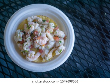 Shrimp Ceviche Tostada On A White Plate