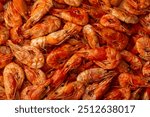 Shrimp close-up in a large pile. Smoked and salted shrimp with spices for a beer snack.