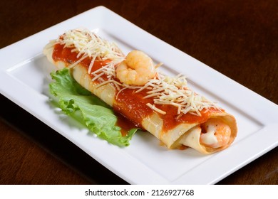 Shrimp Crepe With Grated Parmesan And Tomato Sauce.