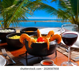 Shrimp and fish moqueca at a beachfront restaurant in Bahia