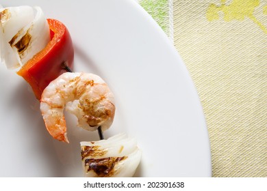 Shrimp Kabob On A White Plate 