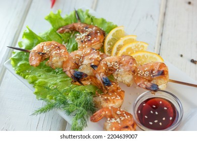 Shrimp Kebab On A Plate Over The Table