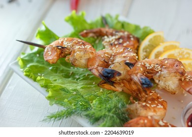 Shrimp Kebab On A Plate Over The Table