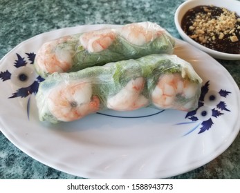 Shrimp And Lettuce Wrap With Peanut Sauce On Table