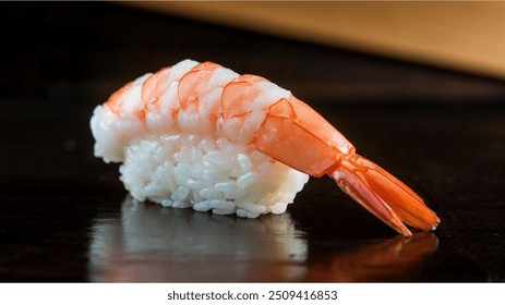 Shrimp Nigiri (Ebi Nigiri): A simple but popular sushi, featuring cooked shrimp atop rice, often with a small dab of wasabi in between. - Powered by Shutterstock