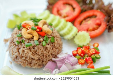 Shrimp Paste Fried Rice , Fried Rice with Shrimp Paste Stir fried rice with shrimp paste, served with fried Chinese sausage, slices of omelettete, and vegetables 