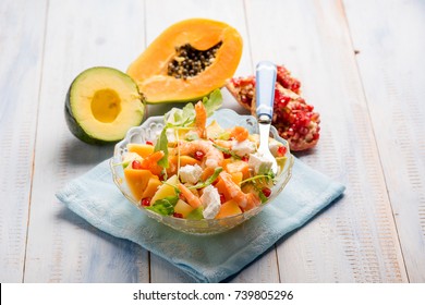 shrimp salad with arugula avocados papaya  pomegranate and feta cheese - Powered by Shutterstock