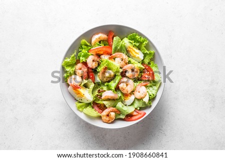 Shrimp Salad. Fresh Seafood Salad on white stone background, top view, copy space.