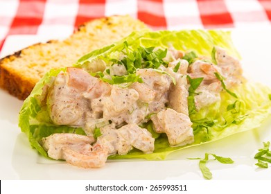 Shrimp Salad Wrap In Lettuce Leaf With Slice Of Jalapeno Cheese Bread.