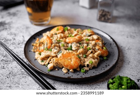 Shrimp  scrambled eggs with scallion in a plate. toning