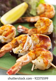 Shrimp Skewer  With Lettuce And Lemon Slice