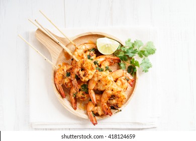 Shrimp Sriracha Kebabs With Lime And Cilantro Leaves