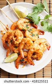 Shrimp Sriracha Kebabs With Lime And Cilantro Leaves