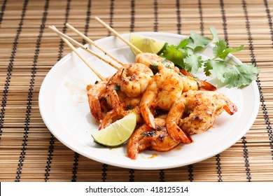 Shrimp Sriracha Kebabs With Lime And Cilantro Leaves