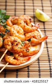 Shrimp Sriracha Kebabs With Lime And Cilantro Leaves