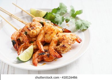 Shrimp Sriracha Kebabs With Lime And Cilantro Leaves