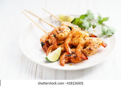 Shrimp Sriracha Kebabs With Lime And Cilantro Leaves