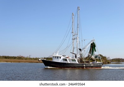 A Shrimp Steel Shrimp Trawler Boat Returns To Port On Bayou Lafourche In Southern Louisiana.