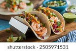 Shrimp Tacos: Soft tortillas filled with seasoned shrimp, fresh veggies, and zesty sauces, offering a light, flavorful twist on traditional tacos.