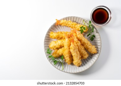 Shrimp Tempura On A Plate Placed On A White Background. Tempura Is A Japanese Food. It Is Japanese Fried Shrimp. View From Above