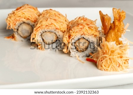 Shrimp tempura with spicy crab meat sushi roll