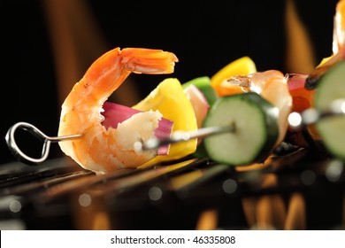 Shrimp And Vegetable Skewer On Grill Closeup