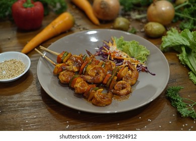 Shrimp And Vegetable Skewers On White Plate, Closeup