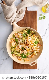 Shrimp And Zucchini Noodles Or Zoodles Pasta With Parmesan And Chili Flakes Cooked In A Cast Iron Pan