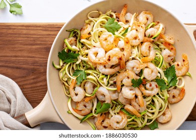 Shrimp And Zucchini Noodles Or Zoodles Pasta With Parmesan And Chili Flakes Cooked In A Cast Iron Pan